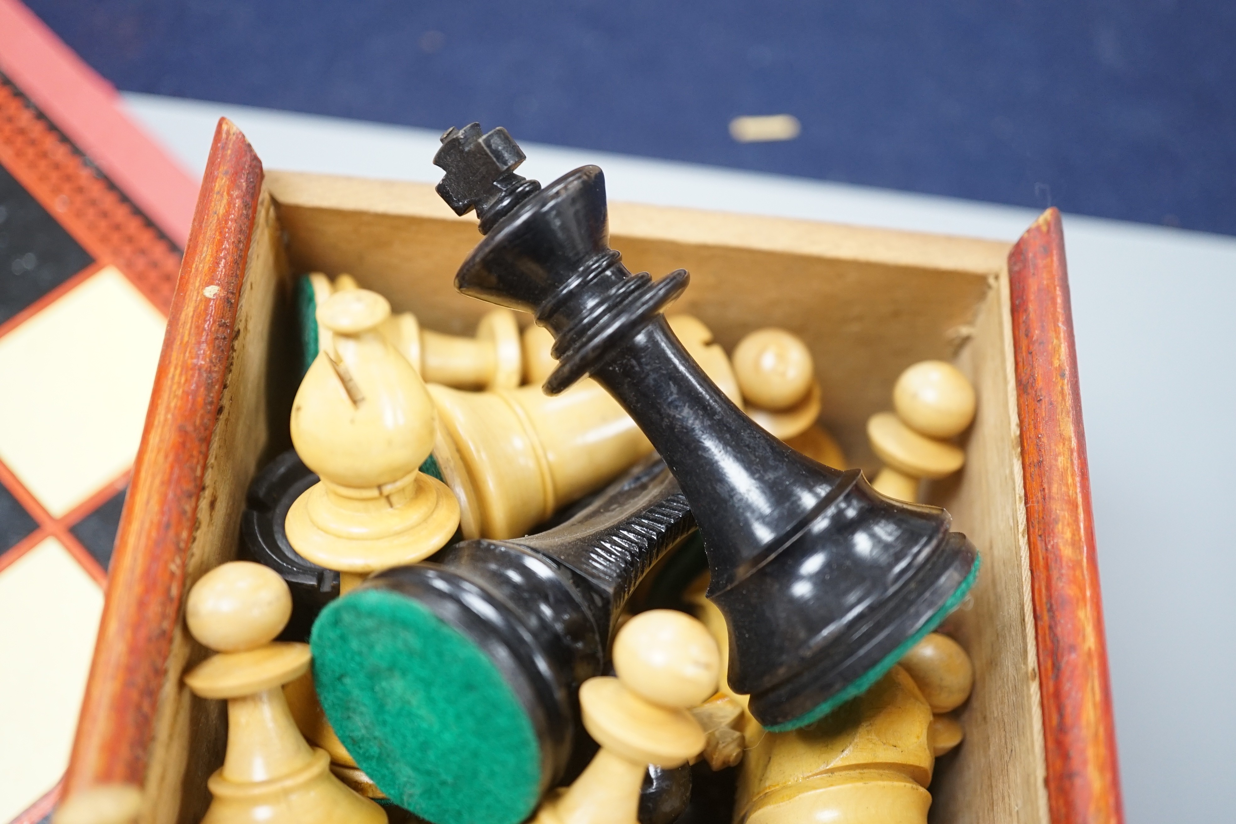 A wooden Staunton chess set and board
